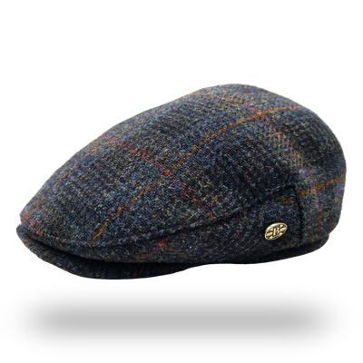 Eriskay Blue Overcheck Harris Tweed Flat Cap, side view with Bullantic badge